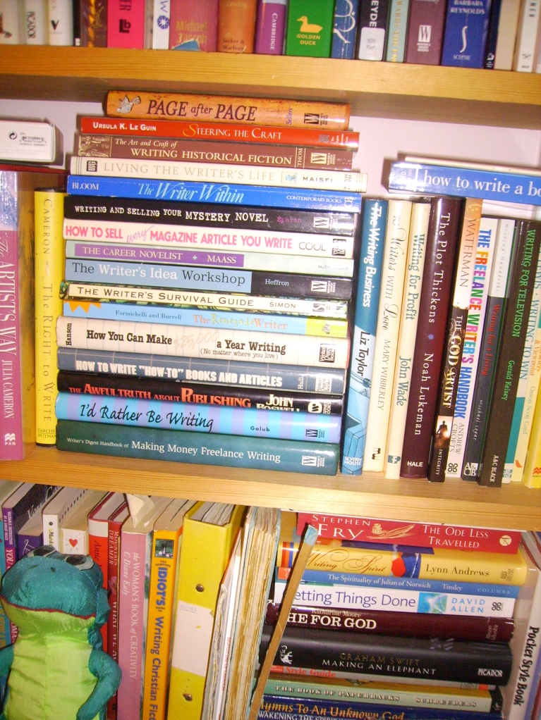 Some of the books, plus frog